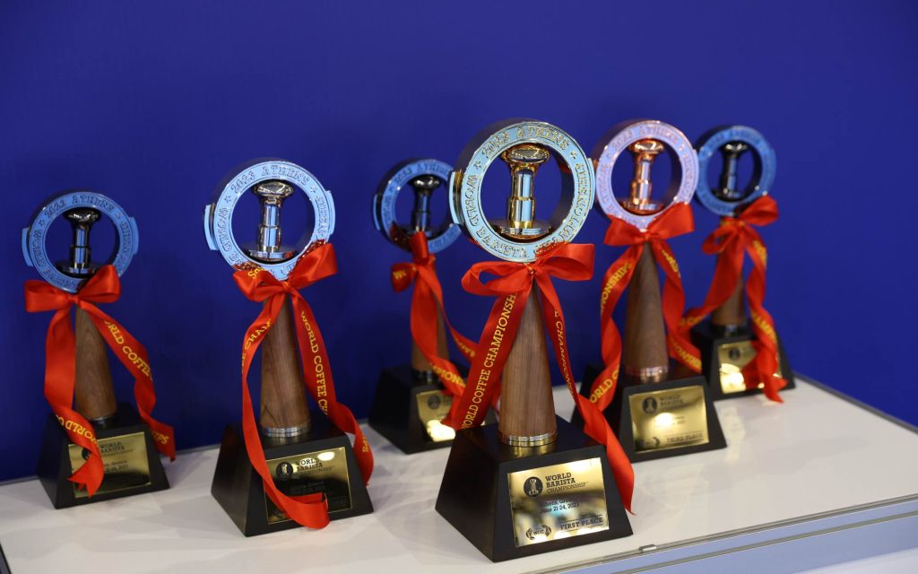 Various trophies on display at a barista championship.