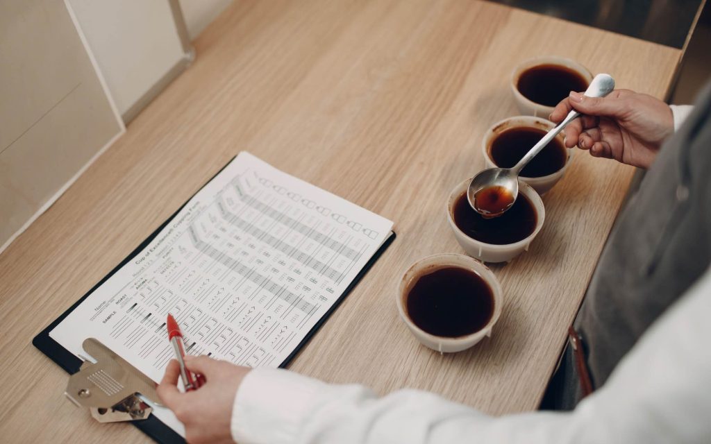 A coffee professional attempts to create a specialty coffee definition in a cupping lab.