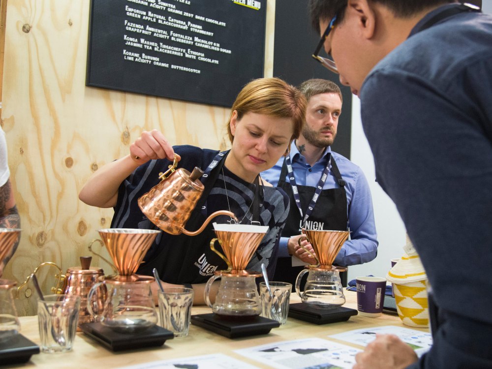 Union Coffee brews a V60 at its stand at the London Coffee Festival.