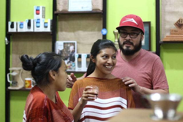 Attendees smile at coffee training