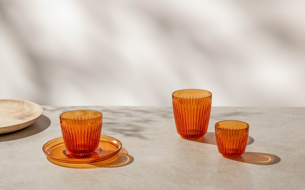 Orange HuskeeRenew cups against a white background.