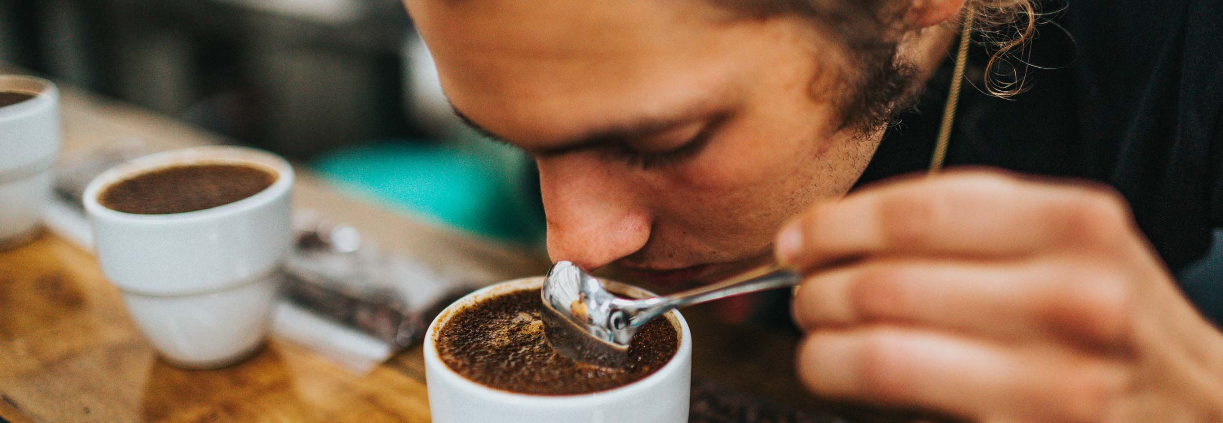 A coffee professional assesses coffee tasting notes at a coffee lab.